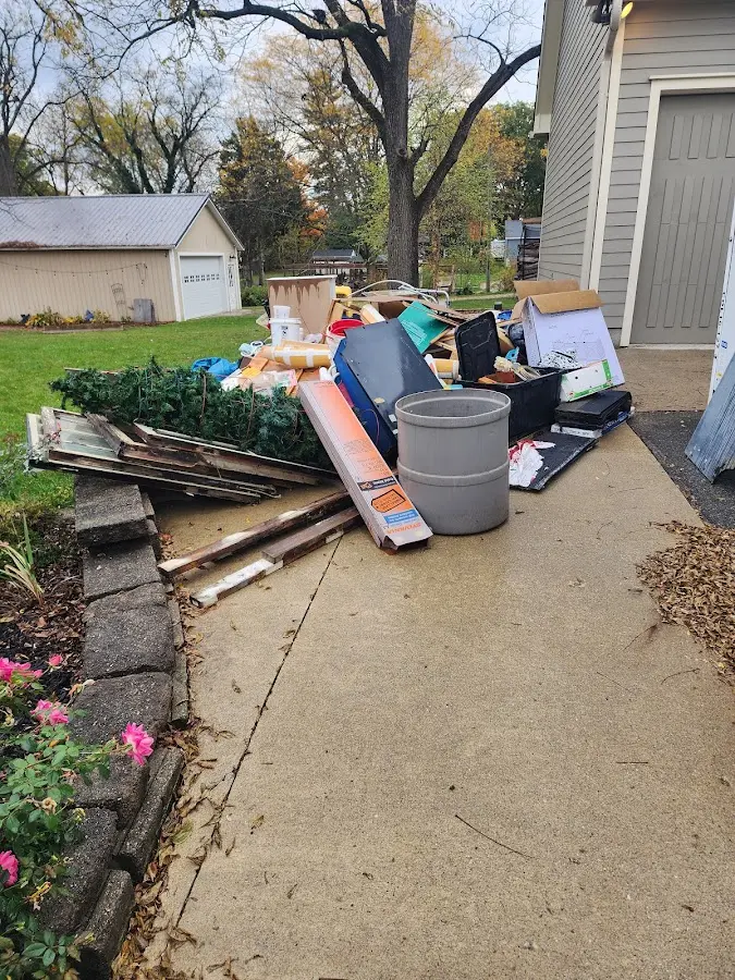 Dumpster being loaded with debris for 3 Yard Dumpster Rental in Uvalde